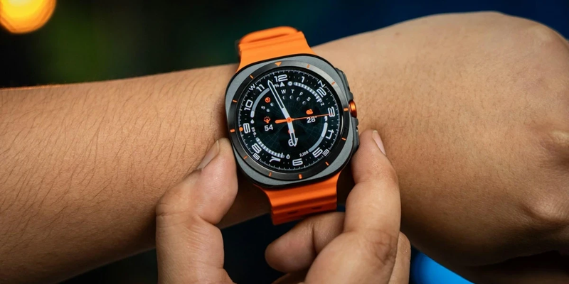 Samsung-watch-on-a-wrist-with-orange-strap
